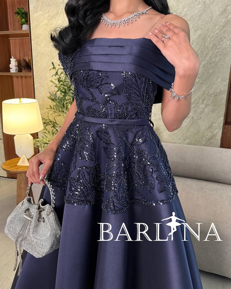 Navy blue evening dress with luxurious embroidery on the chest