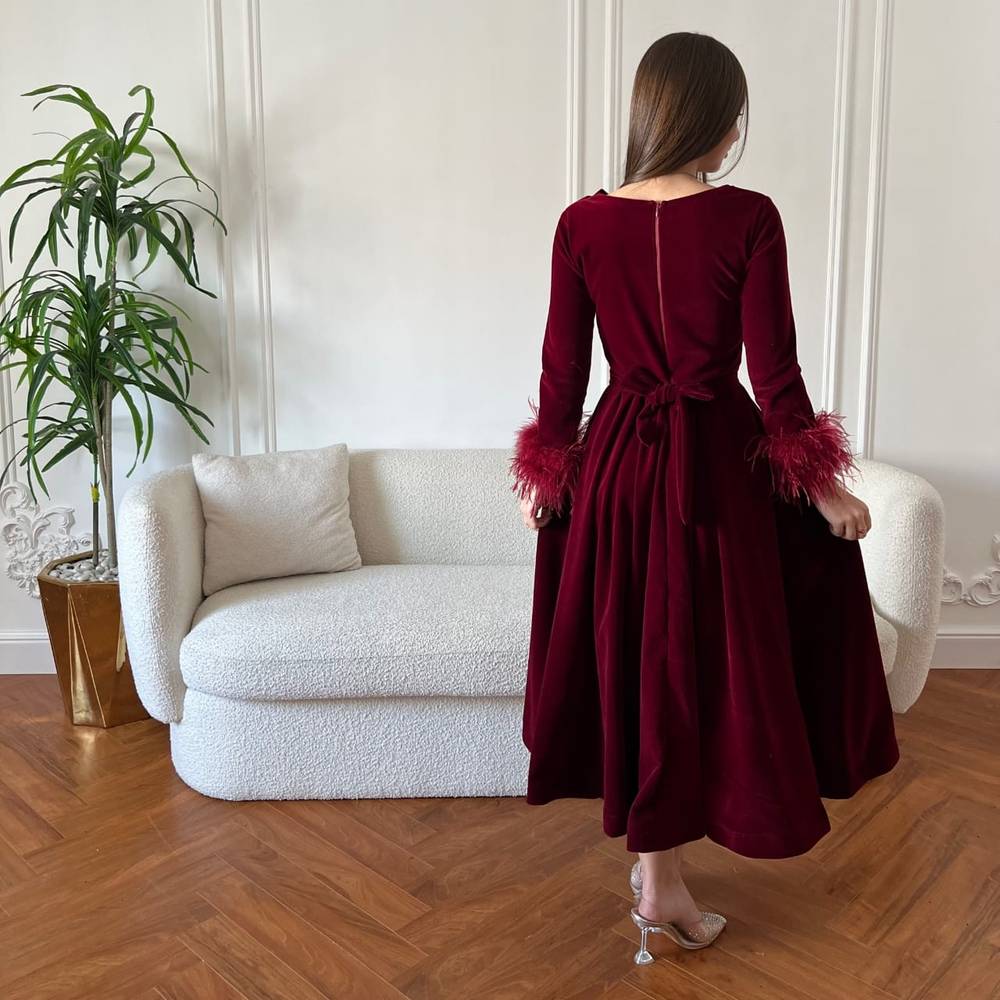 Burgundy velvet dress with feathers