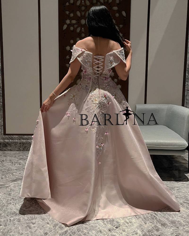 Pink evening dress decorated with elegant beads and embroidery