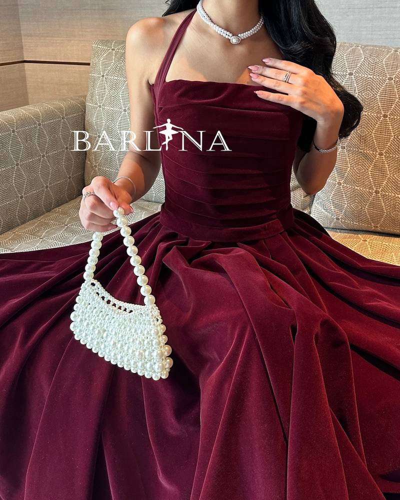 Soft burgundy velvet dress with a tie around the neck