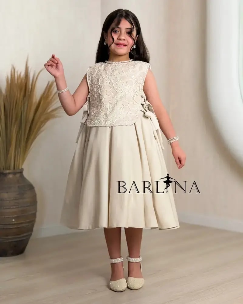 Elegant beige girls' dress with side tie