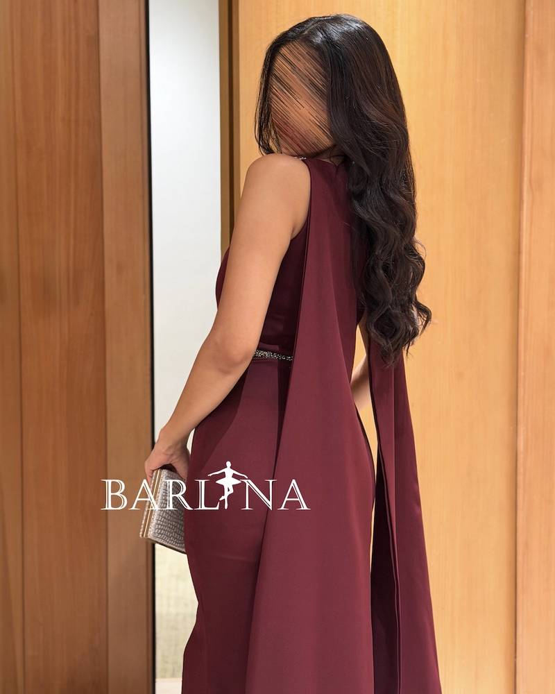 A luxurious burgundy dress with shimmering details