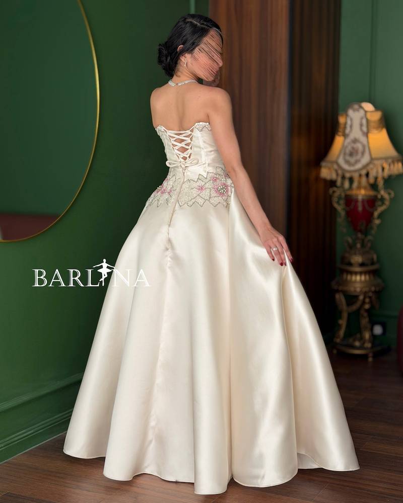 Off-white dress with a pearl-embroidered bodice