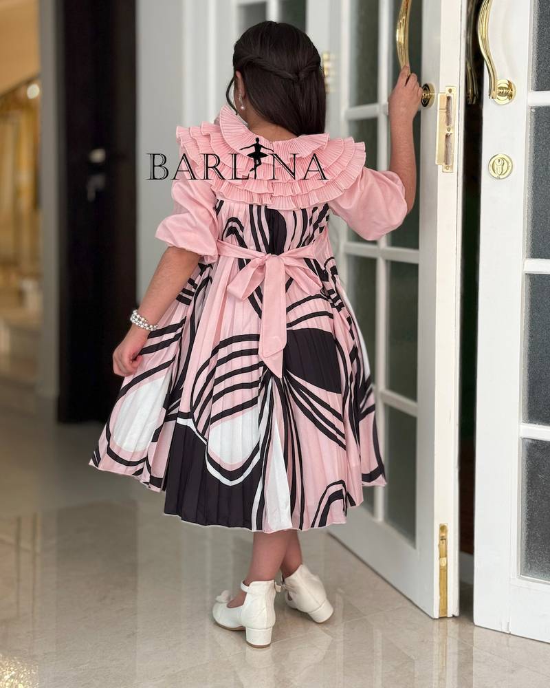 Girls' dress with a ruffled top and a modern pattern