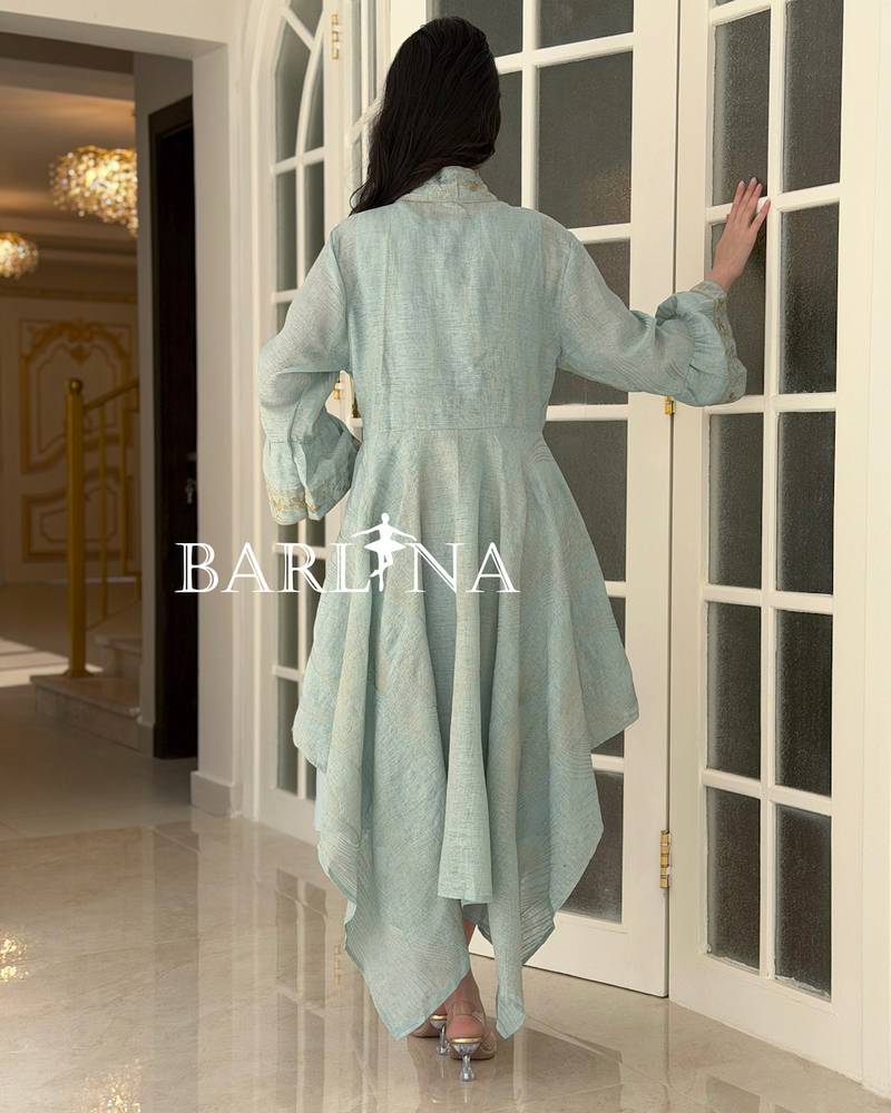 A soft jalabiya with an outer abaya featuring a gold pattern