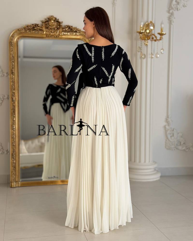 A black and white dress with elegant embroidery
