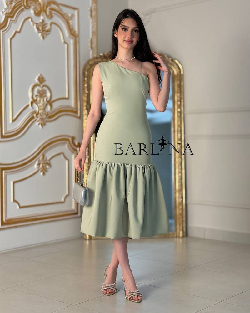 Light green one-shoulder dress with a ruffled hem
