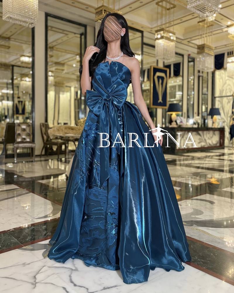 Petrol dress with front bow in shiny fabric