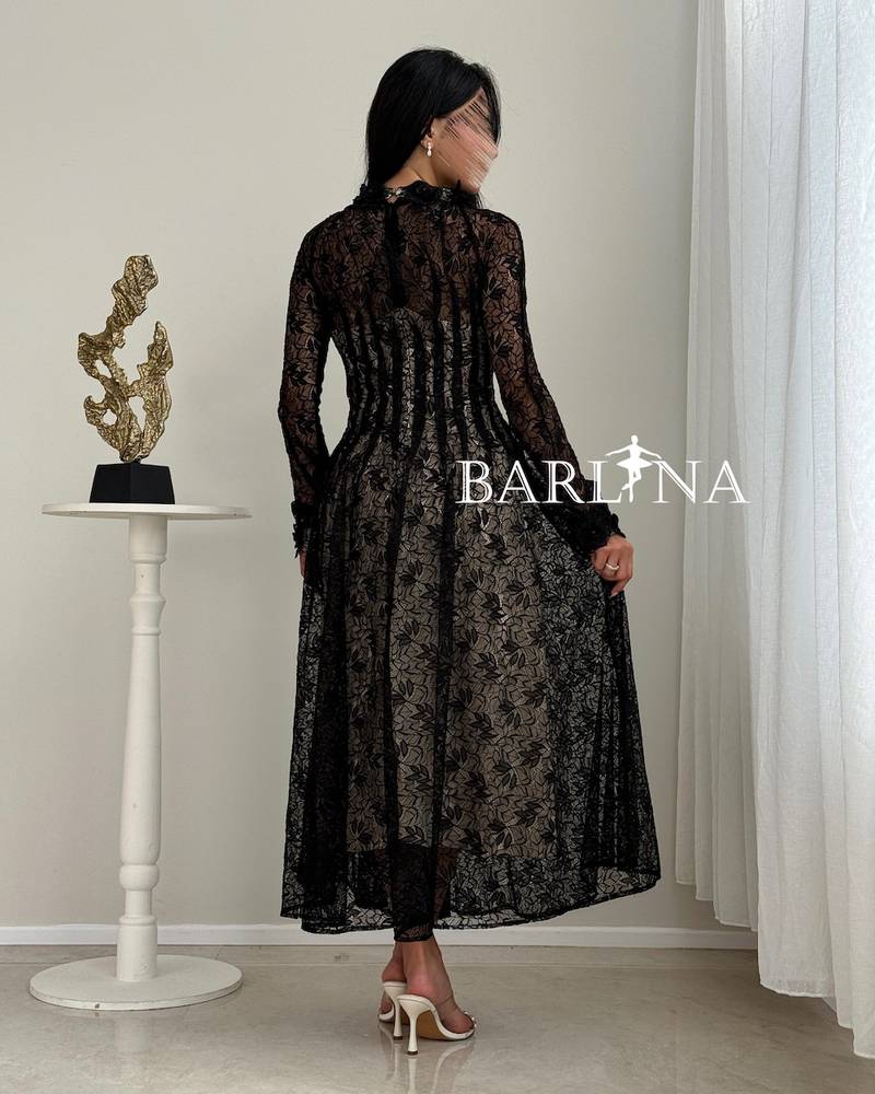 Sheer black lace dress with beige lining
