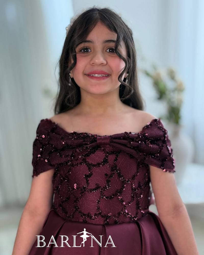 Girls' burgundy evening dress with a wide cut