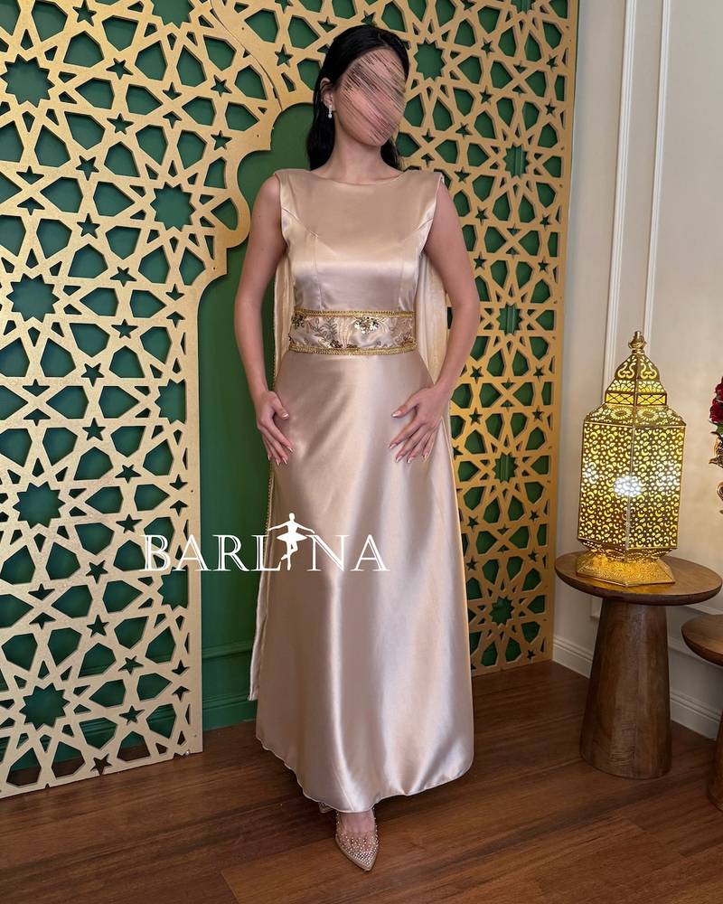 Beige open-back dress with chains