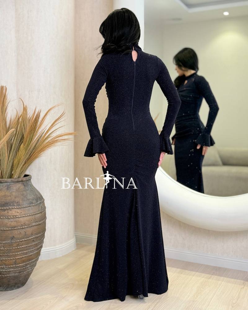 A shiny navy blue dress with wide sleeves at the cuffs