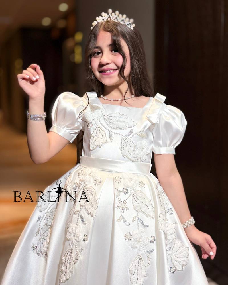 White girl's dress with embroidery on the chest