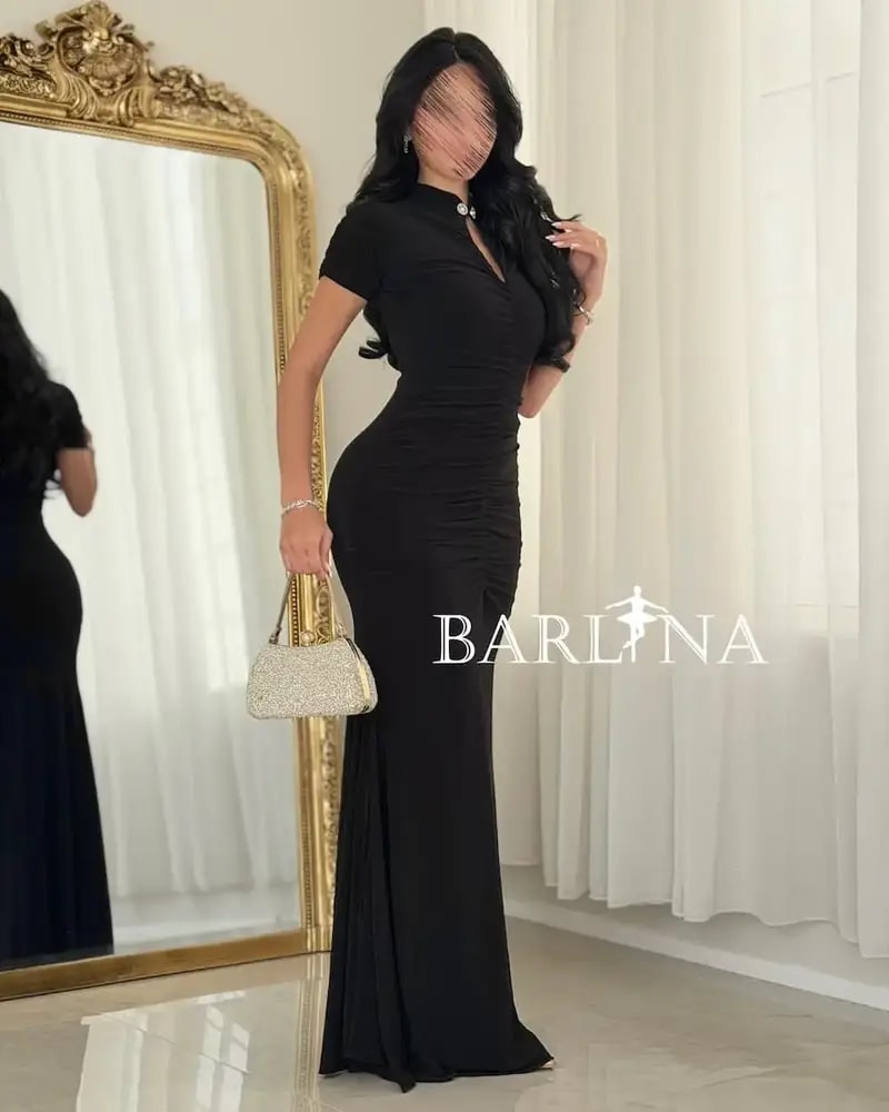 A black dress with delicate details and a classic touch