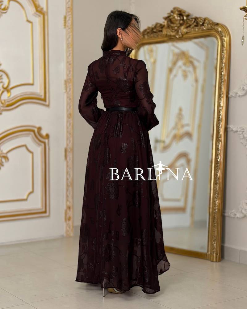 A burgundy floral dress with a gold belt