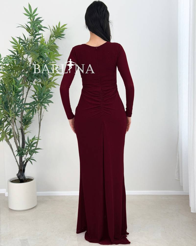 Burgundy dress with a straight cut and side pleats