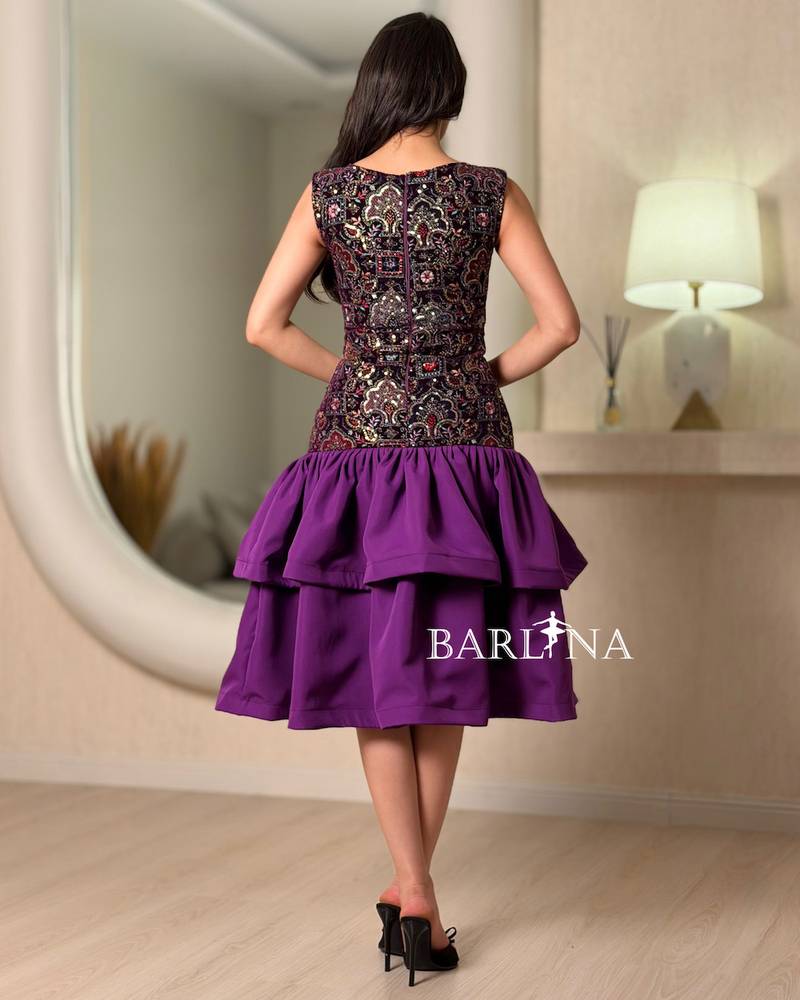 A soft dress with layers and embroidery on the top