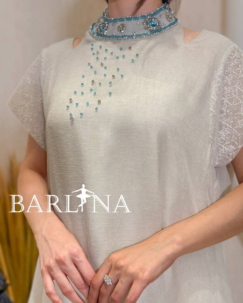 Long beige jalabiya with a bejeweled tie-neck