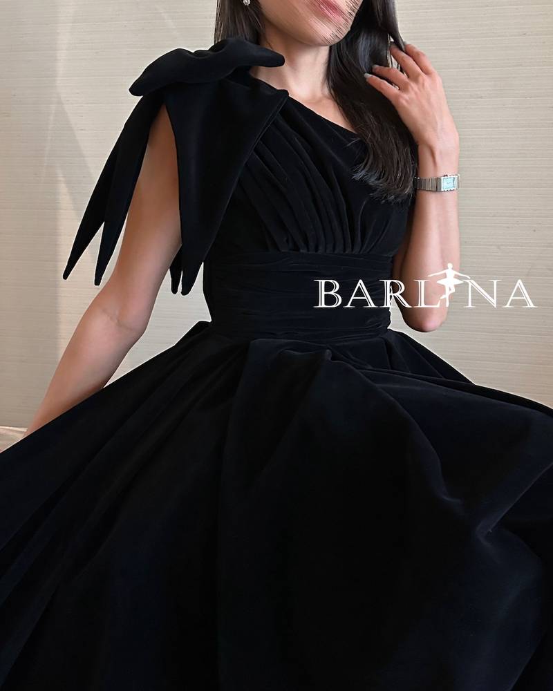 Black velvet dress with bow on the shoulder
