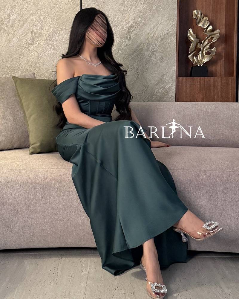 Green evening dress with corset design and front slit