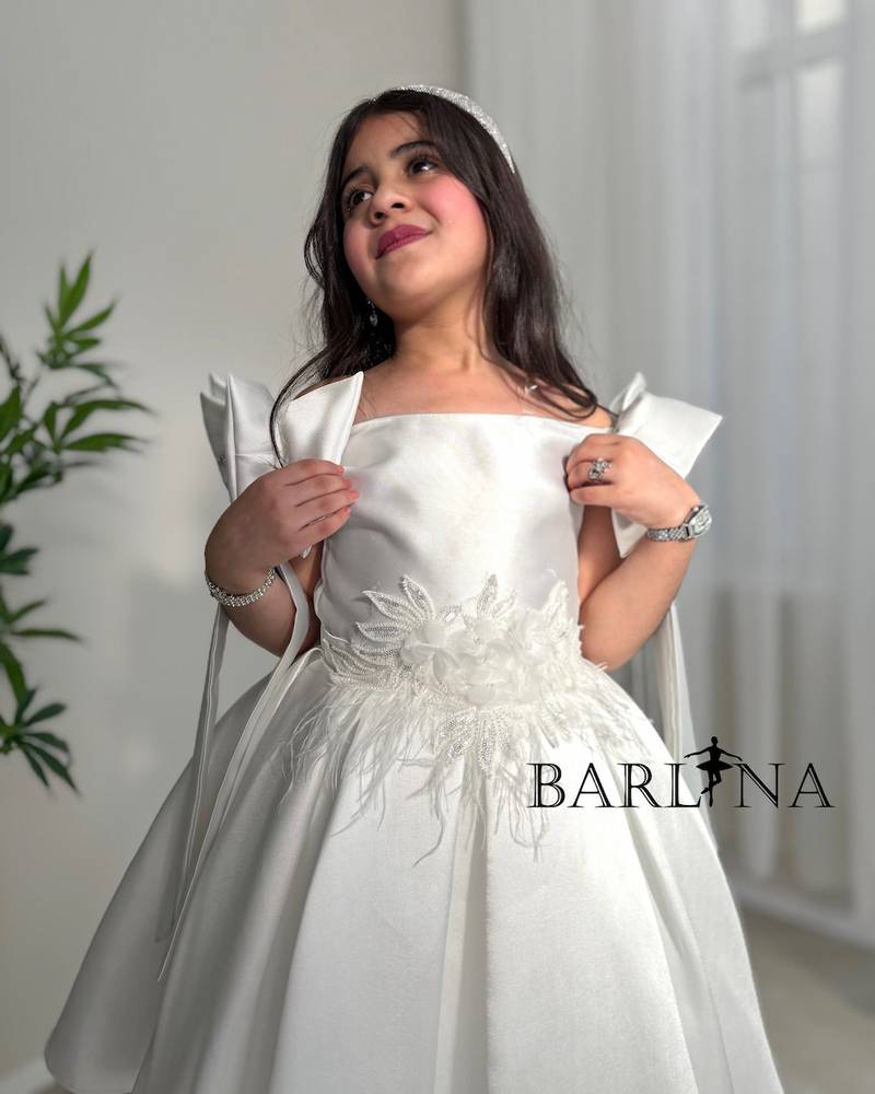 White girl's dress with delicate floral details