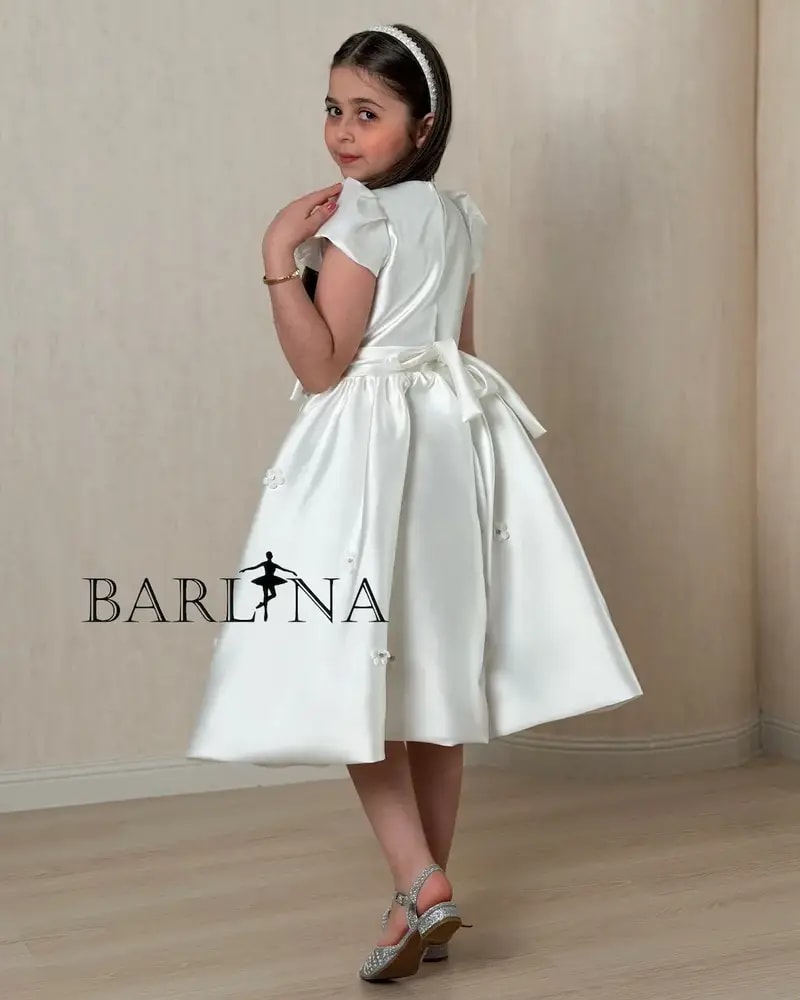 Luxurious white girls' dress adorned with sparkling beads