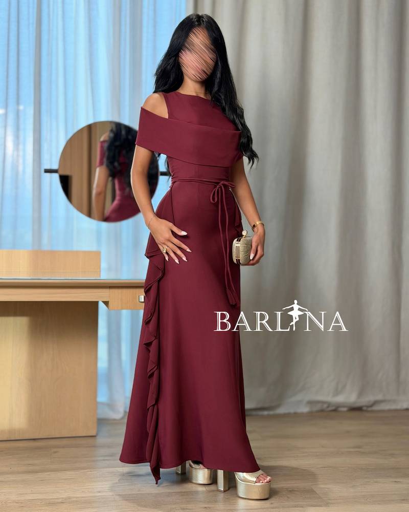 A soft burgundy dress with elegant side ruffles