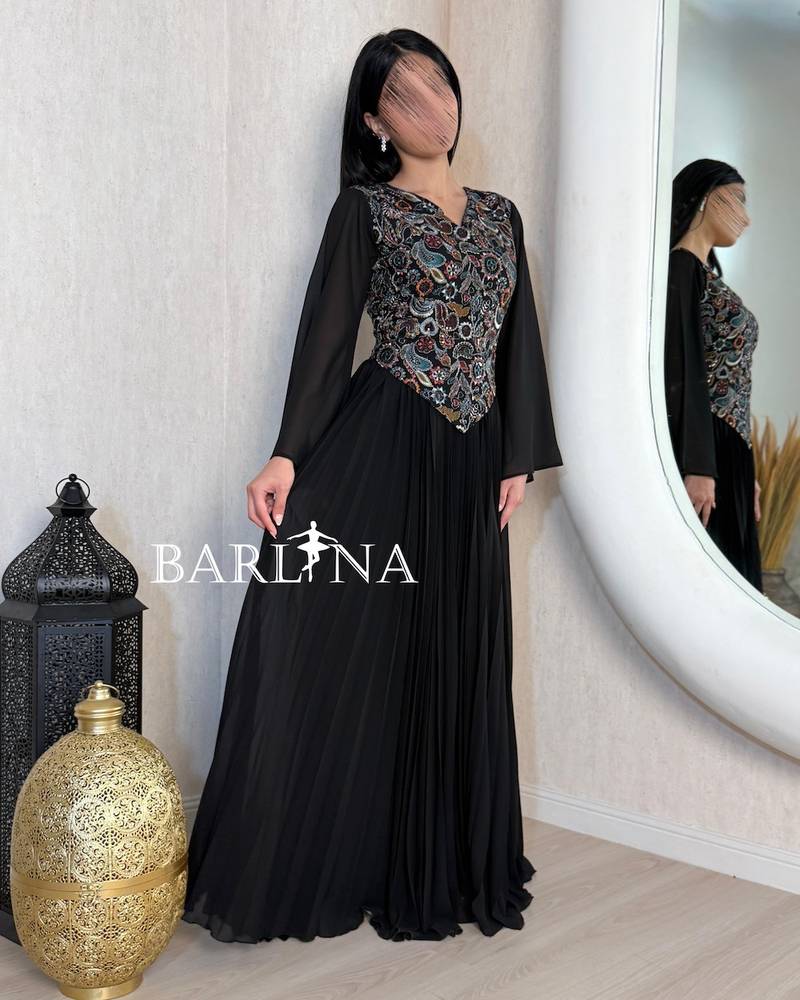 Black pleated jalabiya with an embroidered bodice