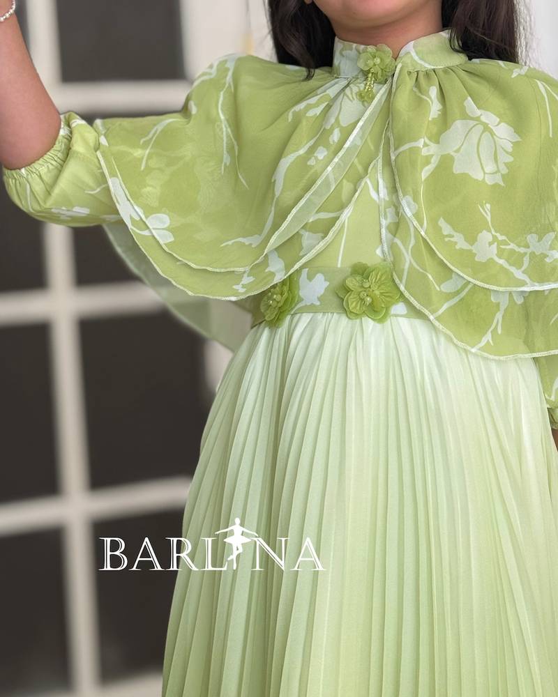 Girls' pleated dress with a floral overlay