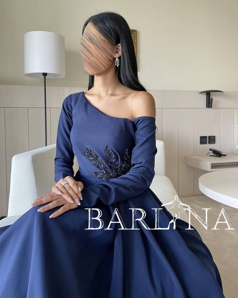 One-shoulder navy blue dress with long sleeves