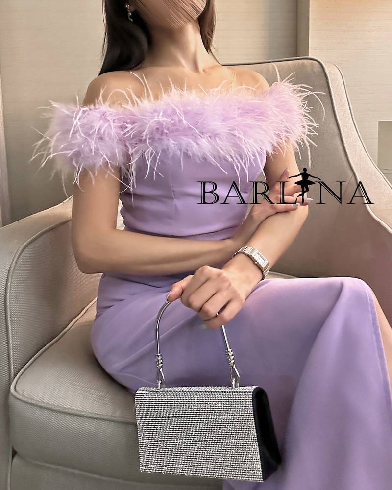 Long purple dress with off-shoulder feathers
