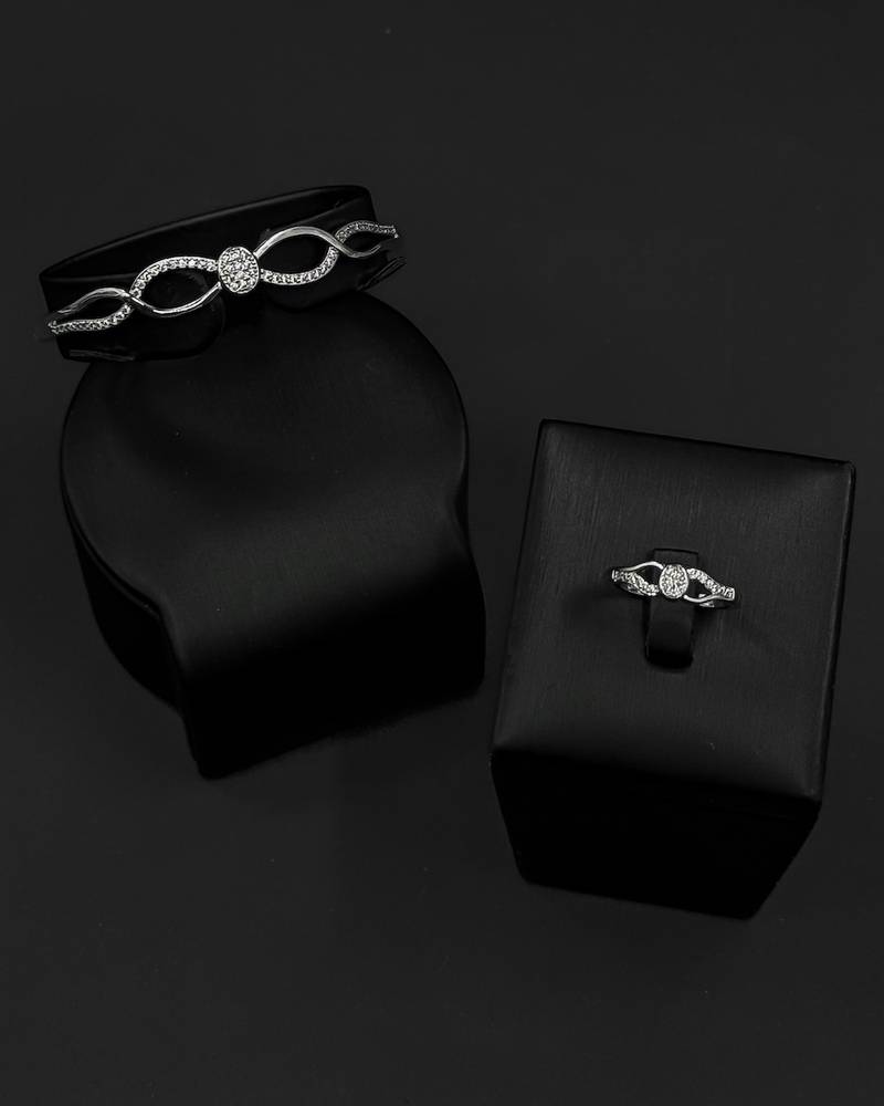 Elegant silver bracelet and ring with flowing lines