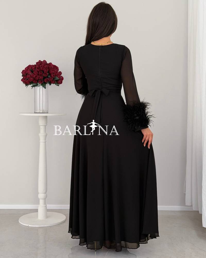 Classic black dress with feathered sleeves