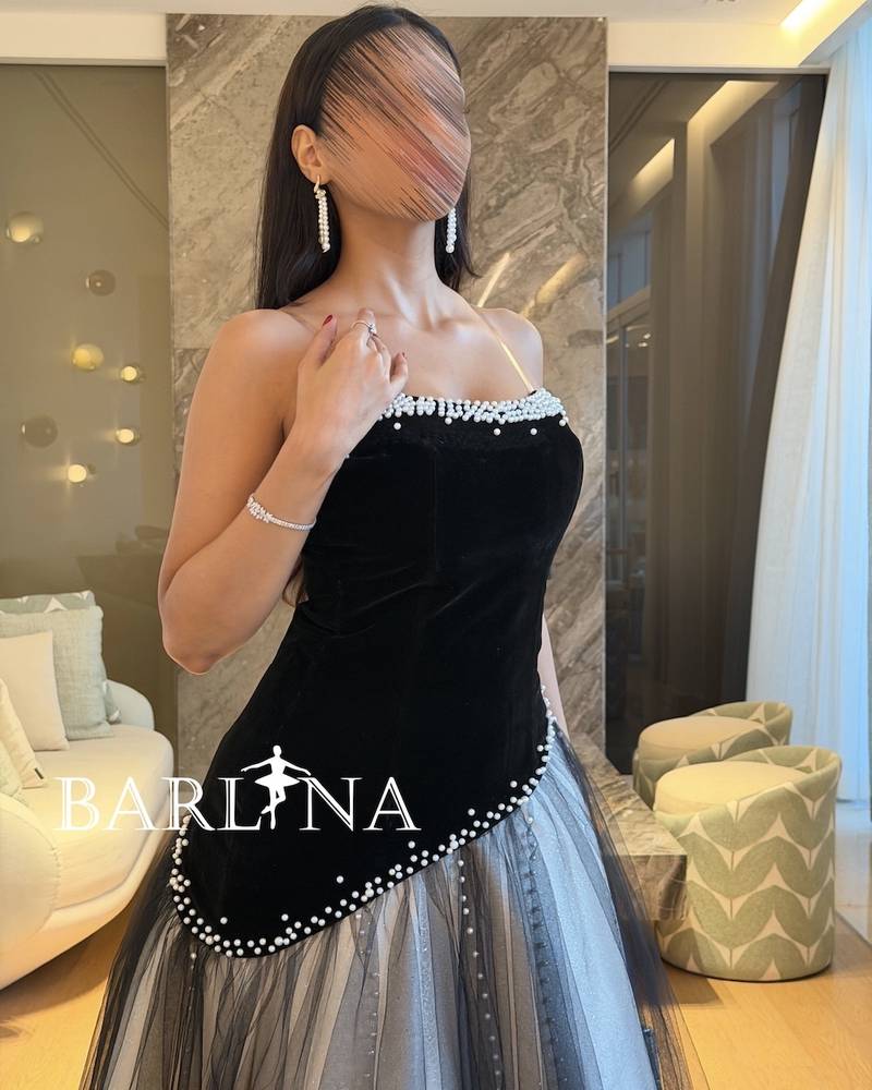 A black and silver dress with delicate pearl embroidery