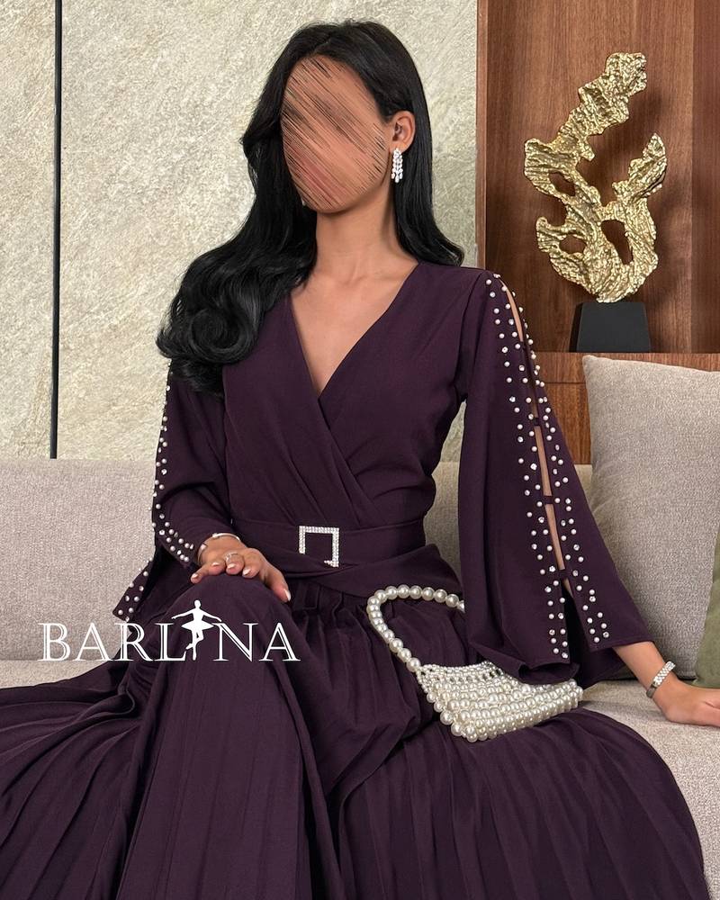 Dark purple dress with pearl embellished sleeves