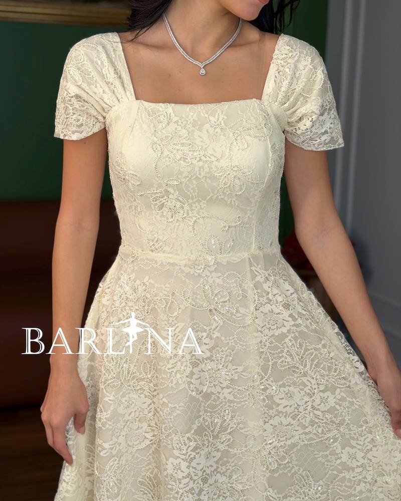 A dress made of soft off-white lace