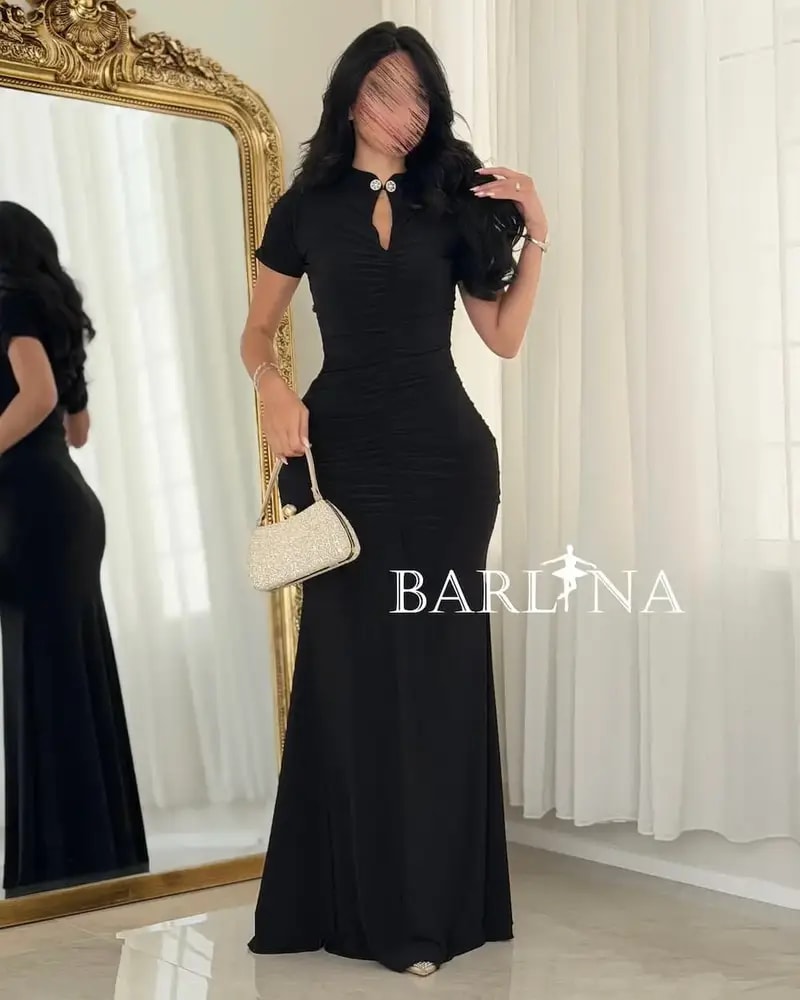 A black dress with delicate details and a classic touch