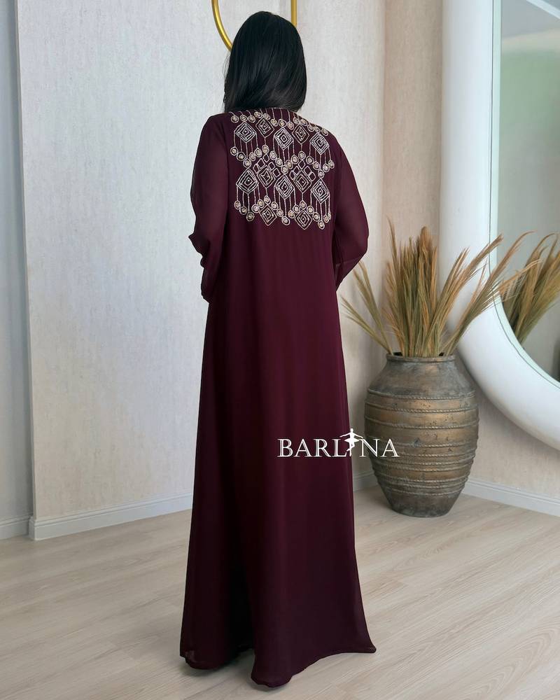 Burgundy jalabiya adorned with delicate embroidery on the chest