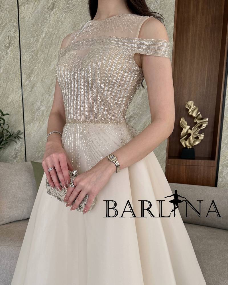 Light beige evening dress with royal embroidery