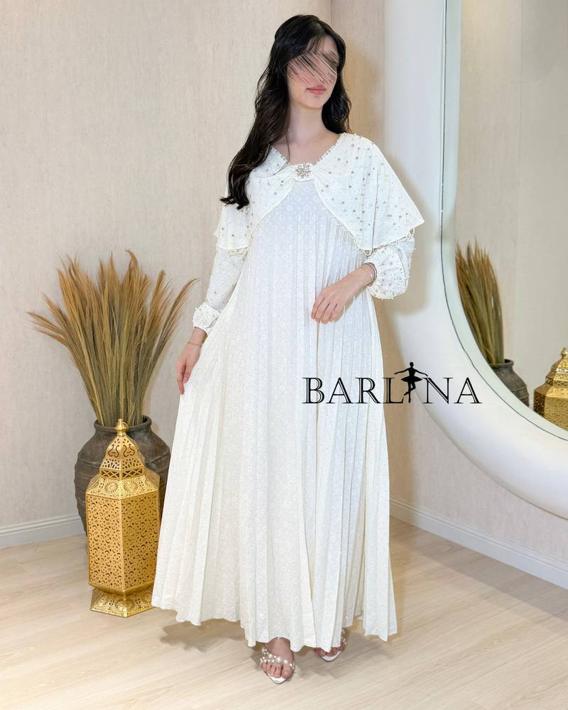 White pleated jalabiya with embroidered cape