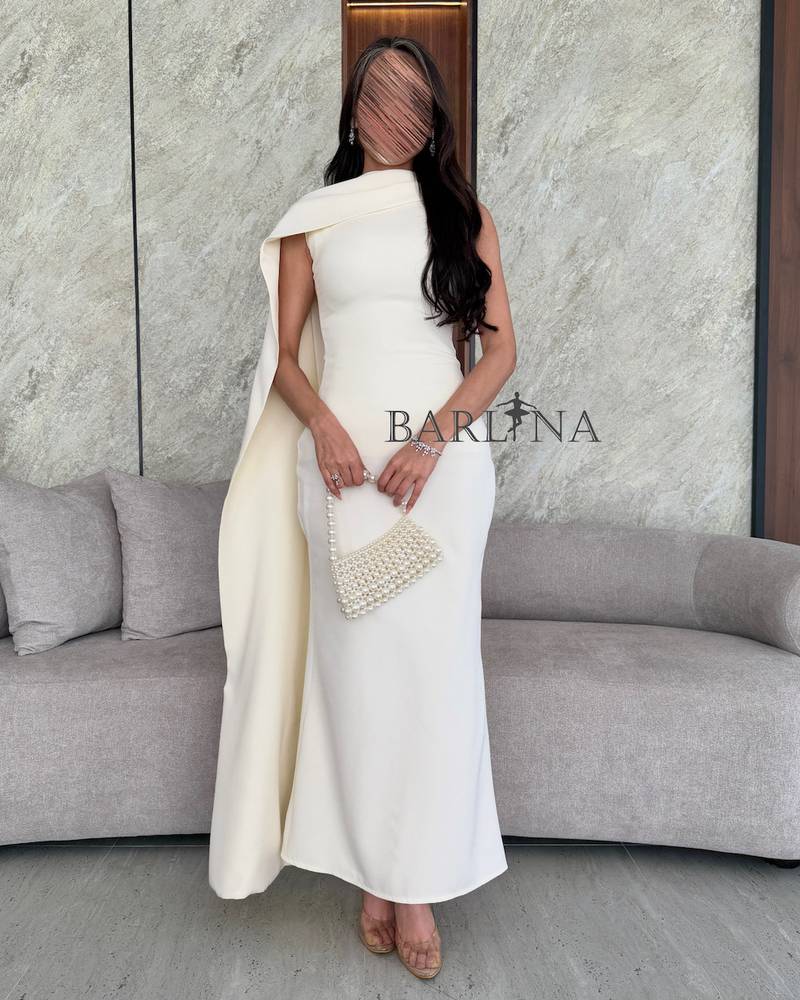 White one shoulder dress with draped fabric