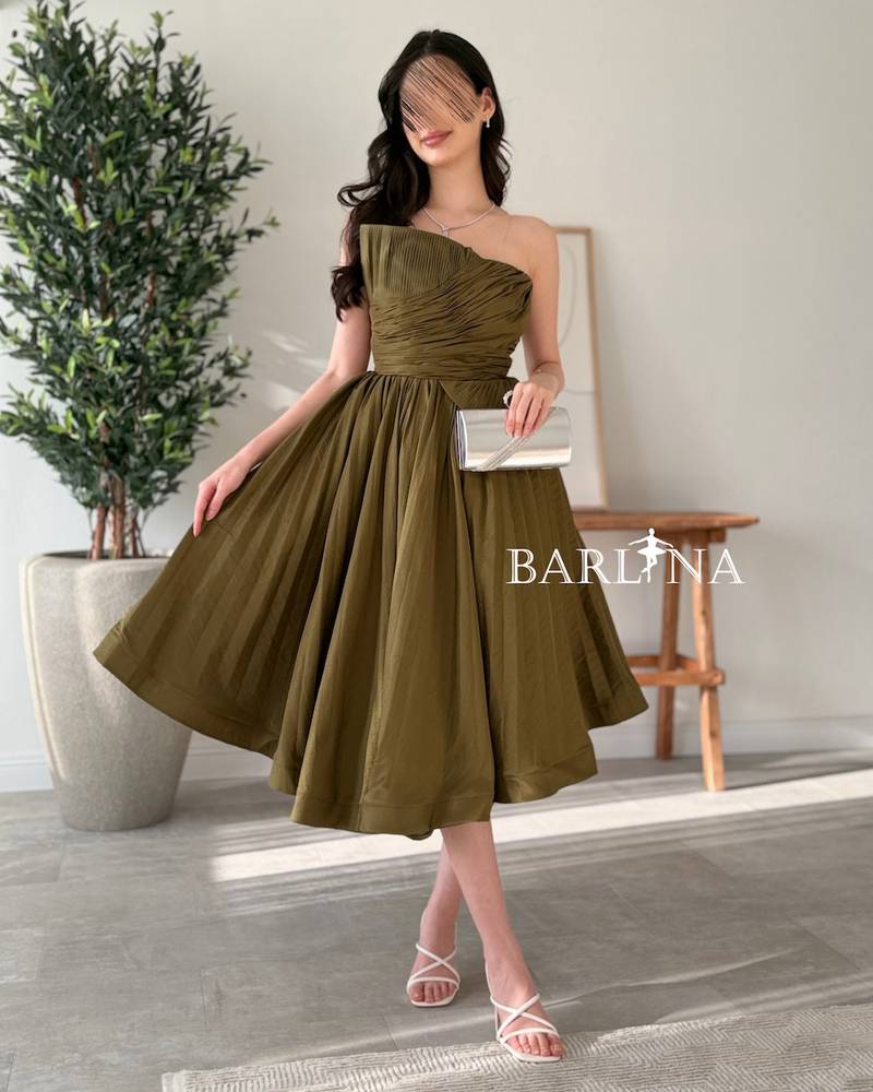 Olive green sleeveless dress with ruffled bodice