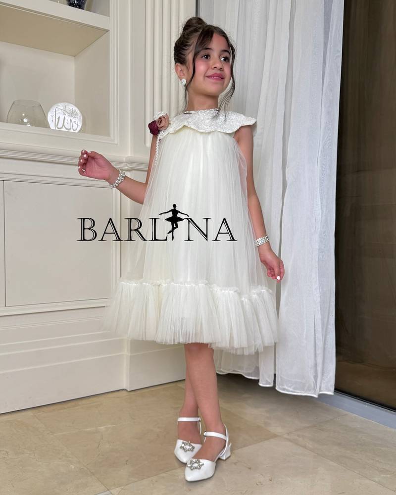 Ivory tulle girls' dress with a soft design