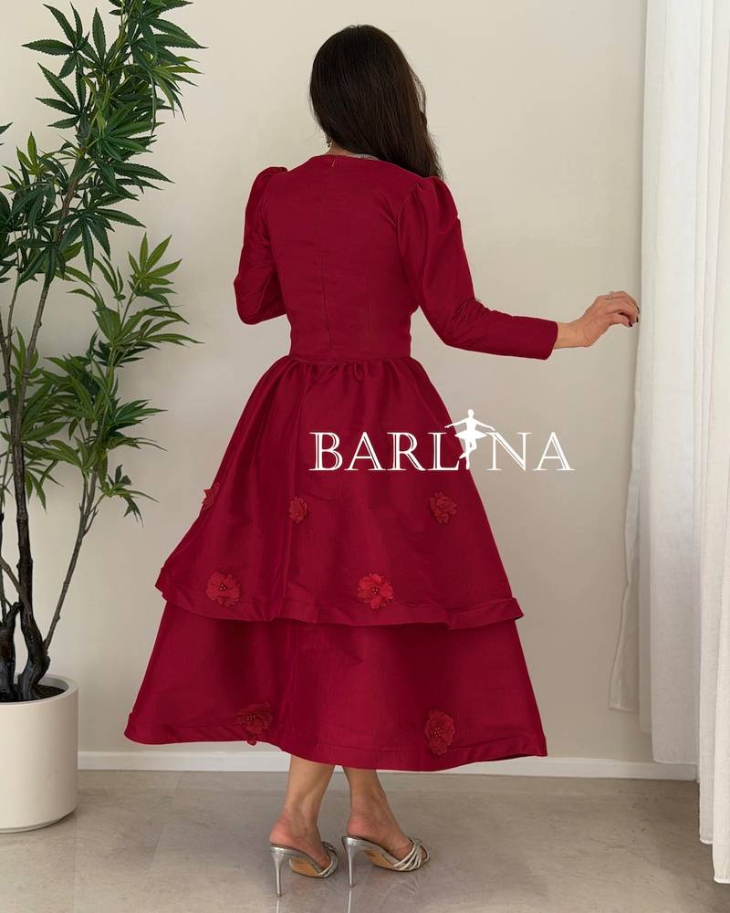 A burgundy mid-length dress with a sweetheart neckline