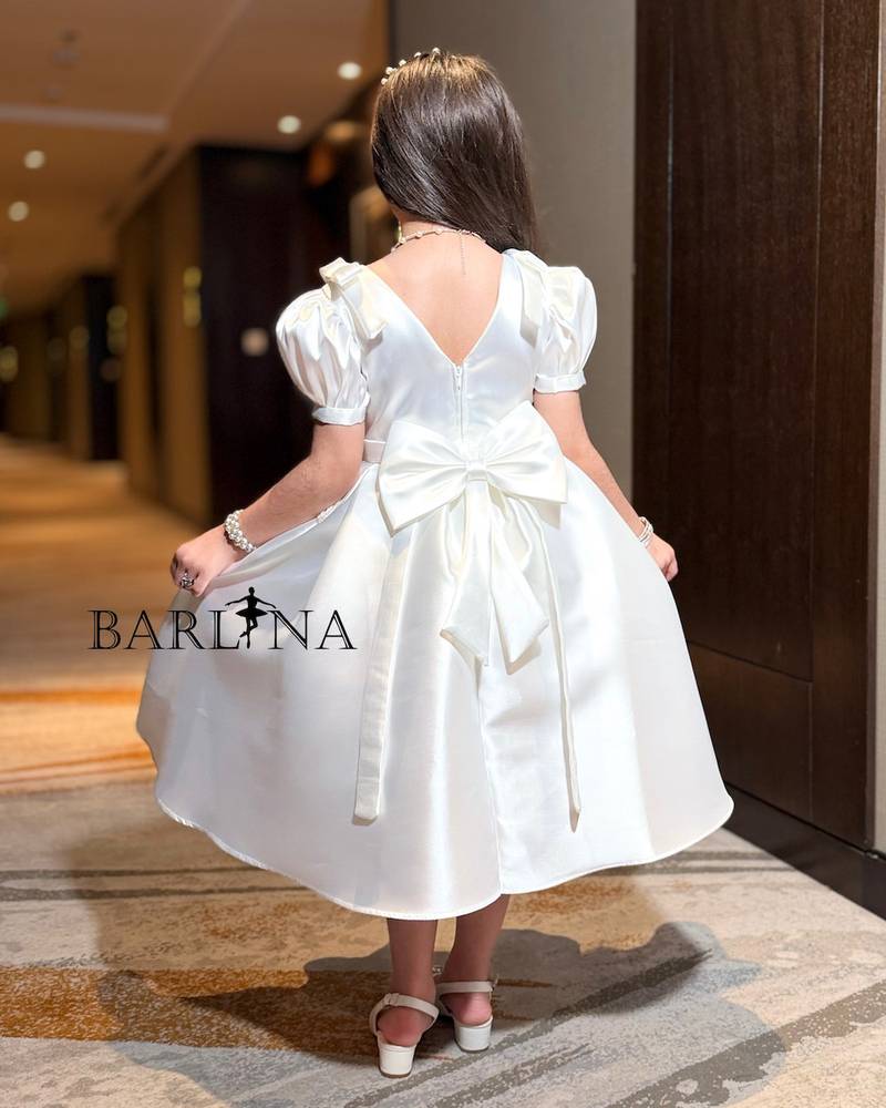 White girl's dress with embroidery on the chest