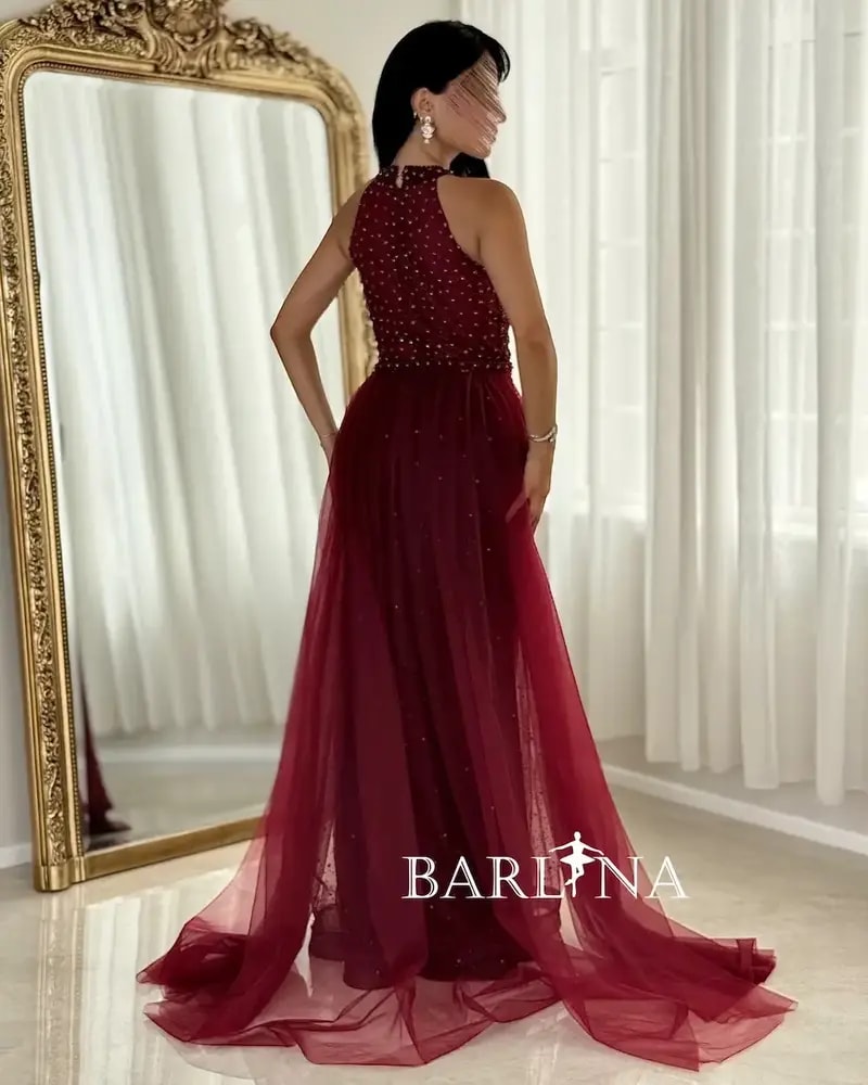 Burgundy embroidered evening dress with a train