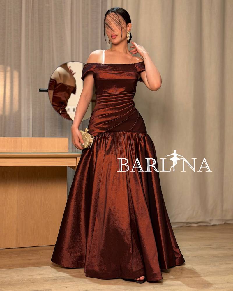 A shimmering off-the-shoulder evening dress