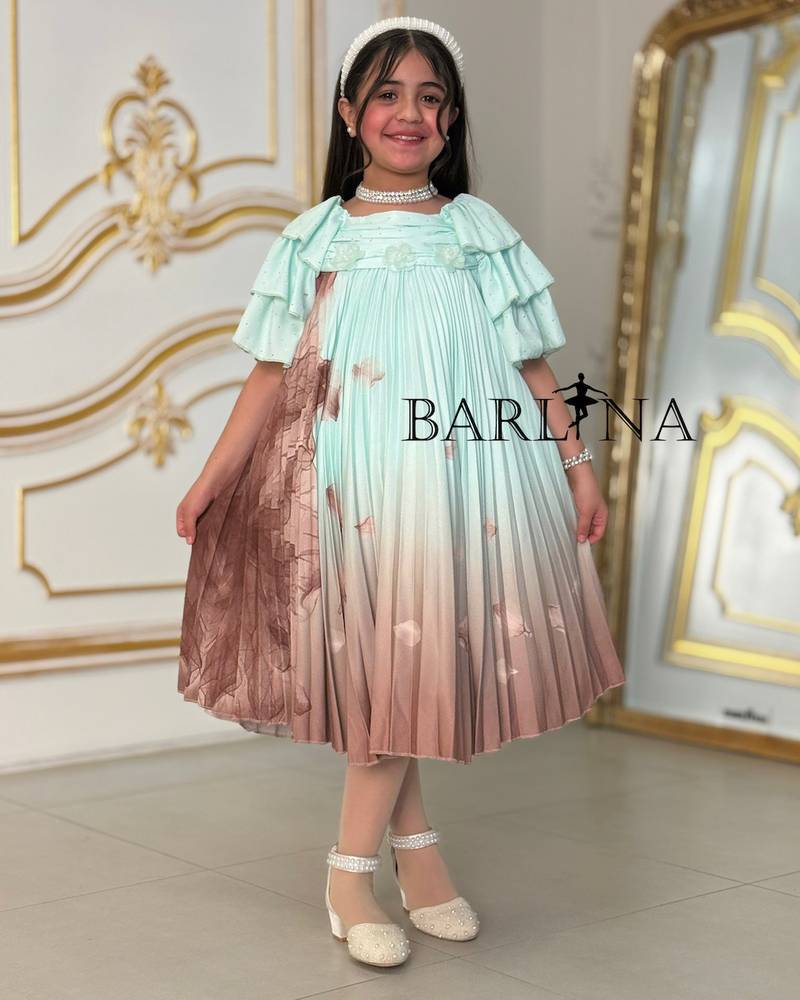 A soft girl's dress decorated with delicate prints