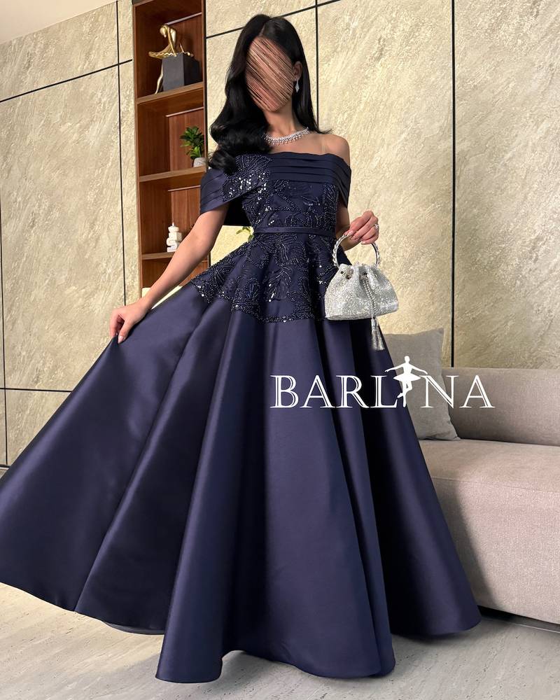 Navy blue evening dress with luxurious embroidery on the chest