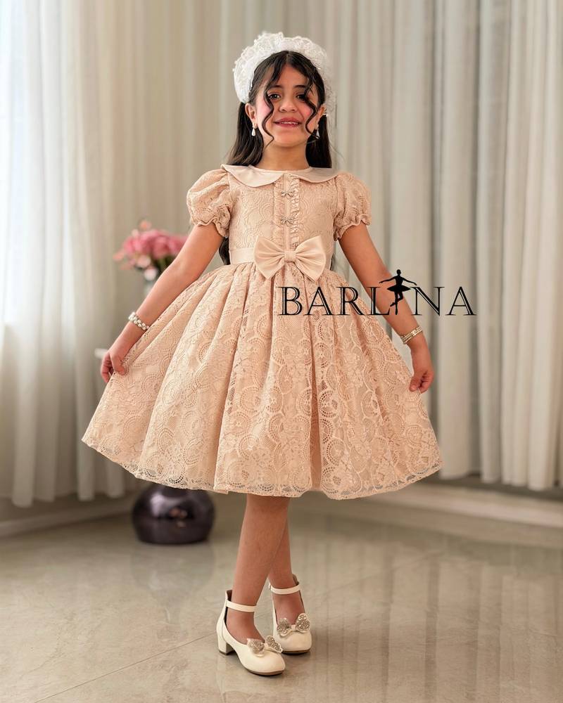 Beige girl's dress with a bow belt